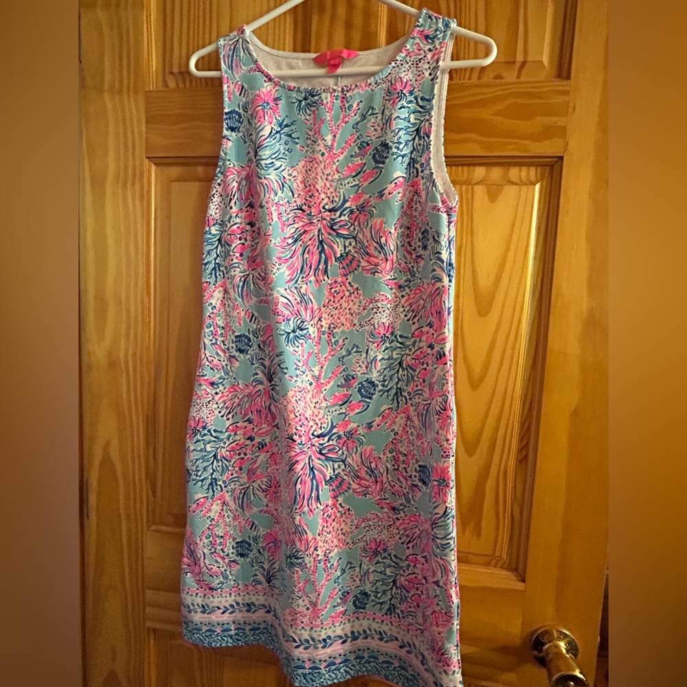 Lilly Pulitzer vibrant dress. Eye catching print, flattering style.